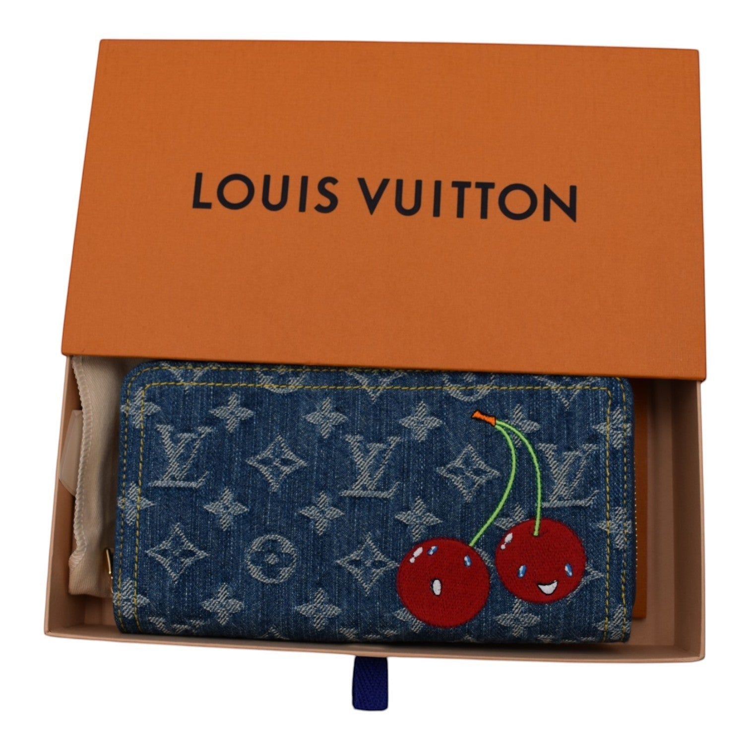 Louis Vuitton denim zippy wallet with embroidered cherry motif and monogram pattern.