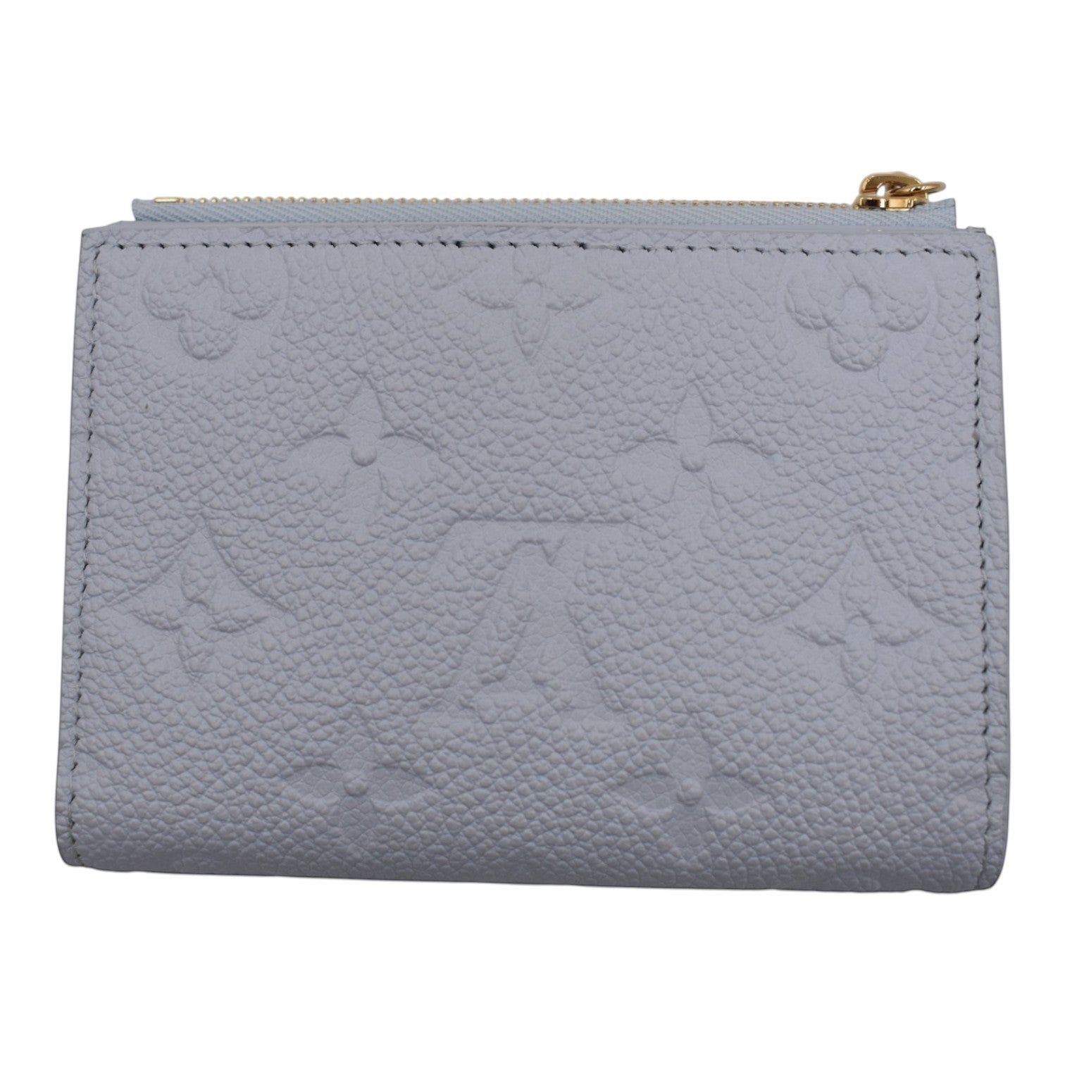 Soldi baby blue Empreinte leather Lisa wallet with embossed monogram pattern and gold zipper.