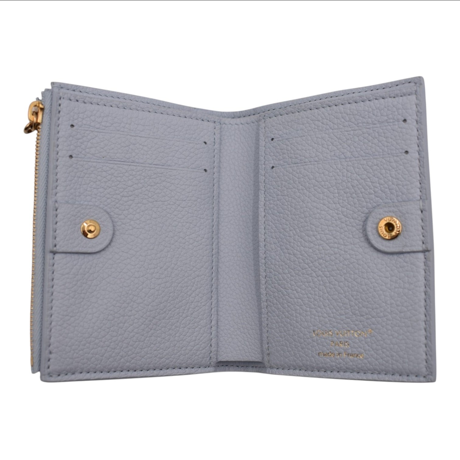 Soldi baby blue Empreinte leather compact wallet with gold snap closure and zip pocket.