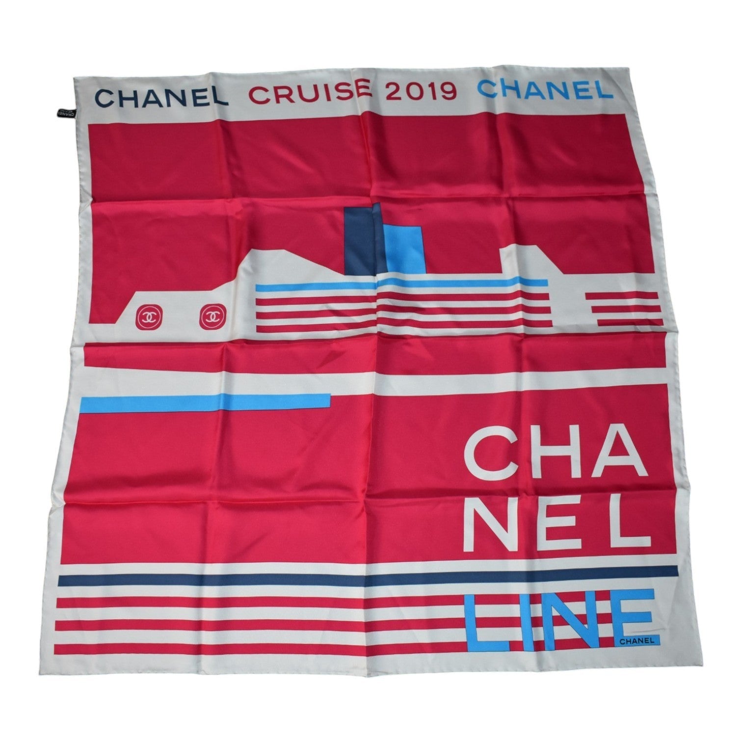 Soldi red silk scarf with white and blue accents, featuring a cruise ship graphic and "CHANEL CRUISE 2019" text.