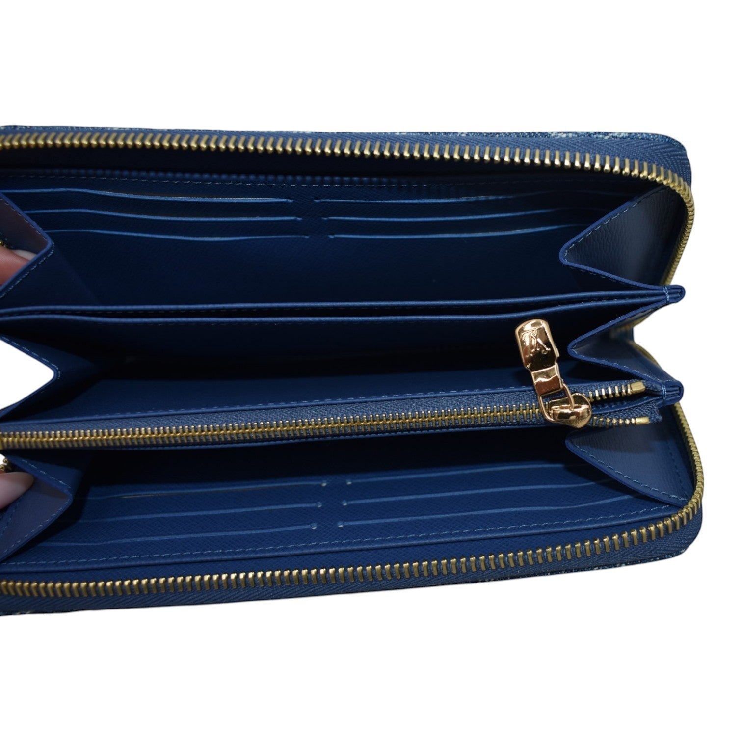 Soldi blue denim zip-around wallet with cherry pattern and gold hardware. Interior card slots and zip pocket.