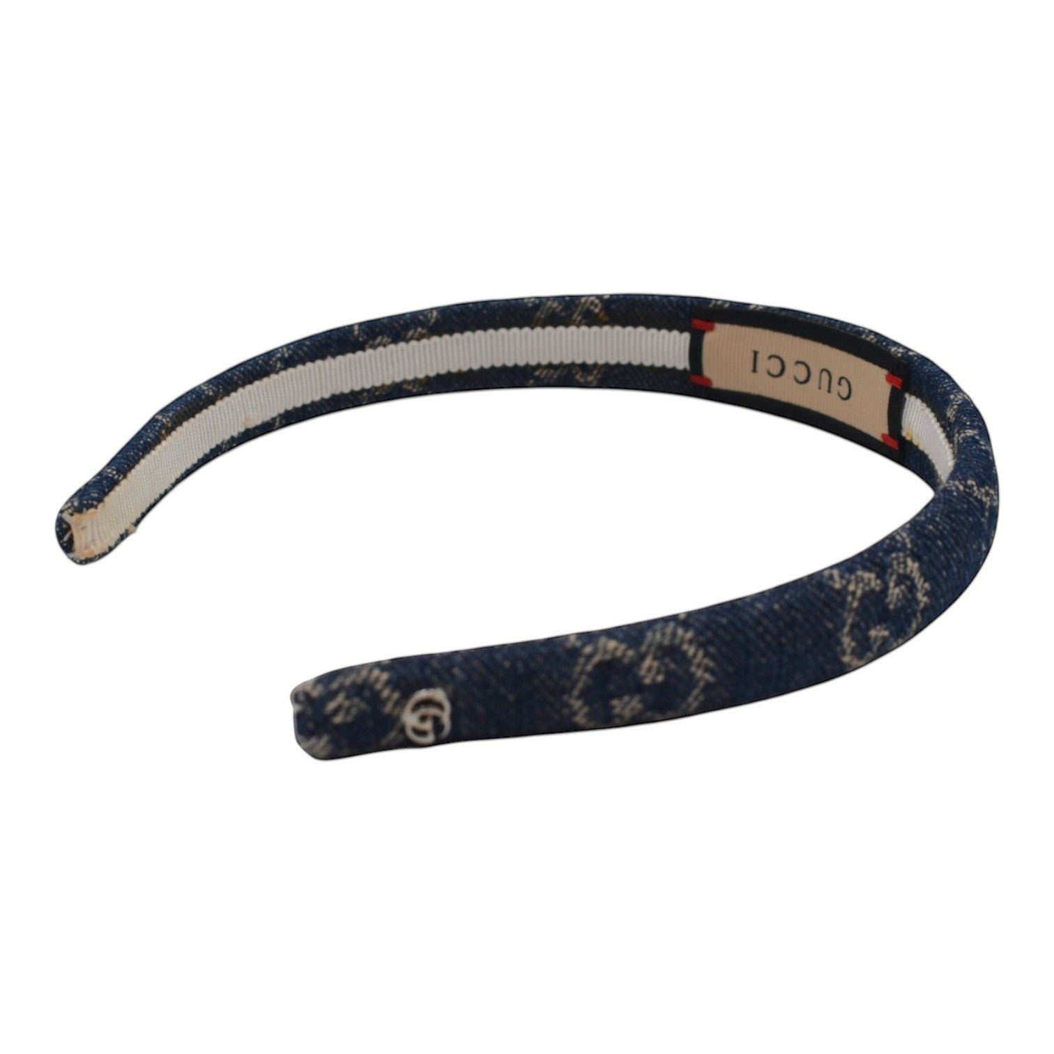 Soldi dark blue denim headband with all-over GG logo pattern and white stripe detail.