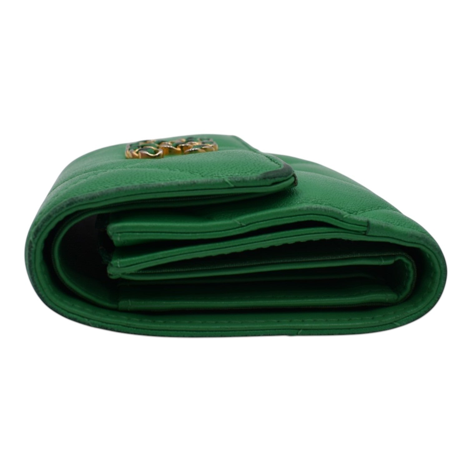 Soldi green compact C19 wallet with gold hardware and quilted stitching.
