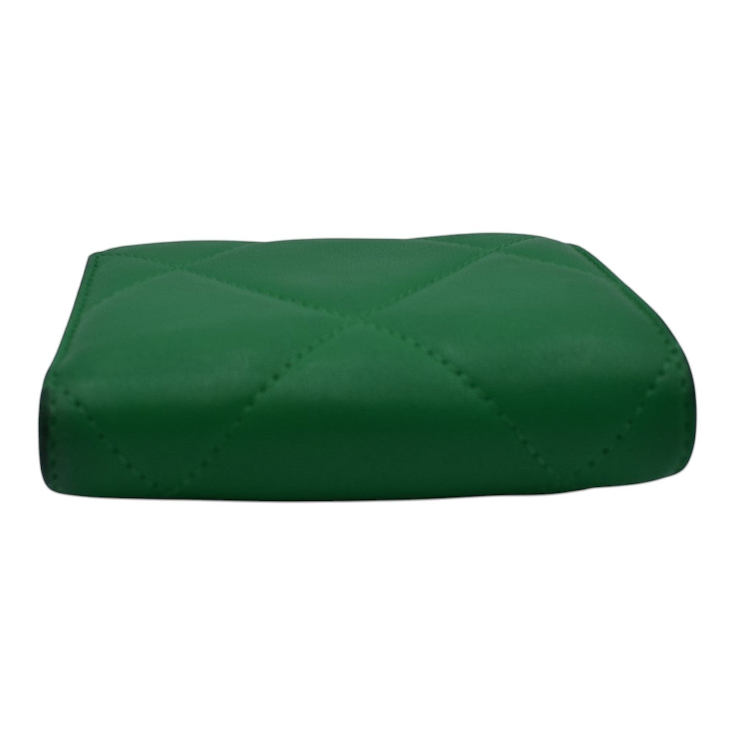 Soldi green quilted compact wallet with diamond stitching. A small, stylish accessory.