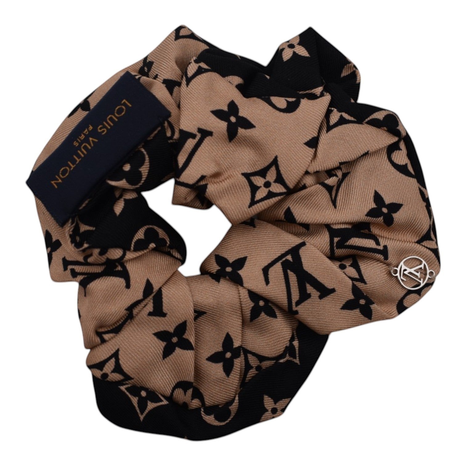Soldi tan and black monogram print scrunchie with Louis Vuitton Paris tag and silver charm.