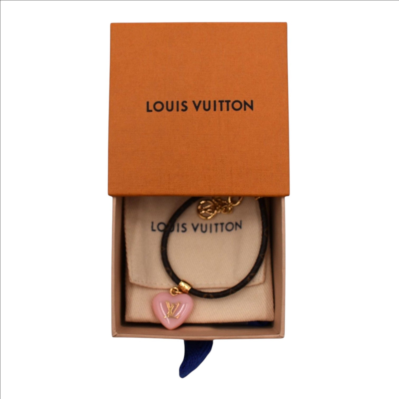 Soldi Monogram Sweetheart Bracelet with pink heart charm and gold accents, presented in a Louis Vuitton box.