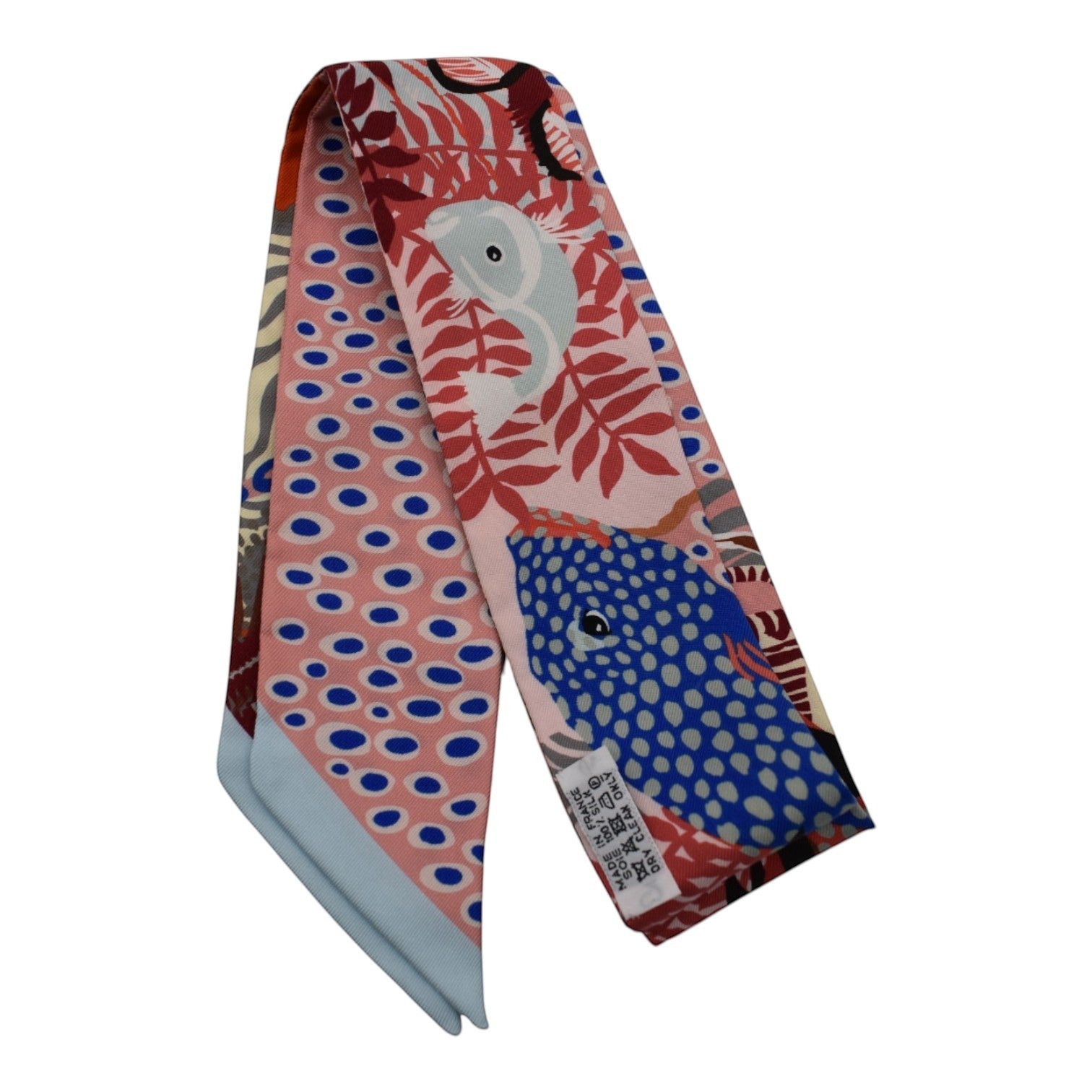 Soldi pink silk twilly scarf with an "Under the Sea" print featuring blue and white fish, coral, and polka dots.