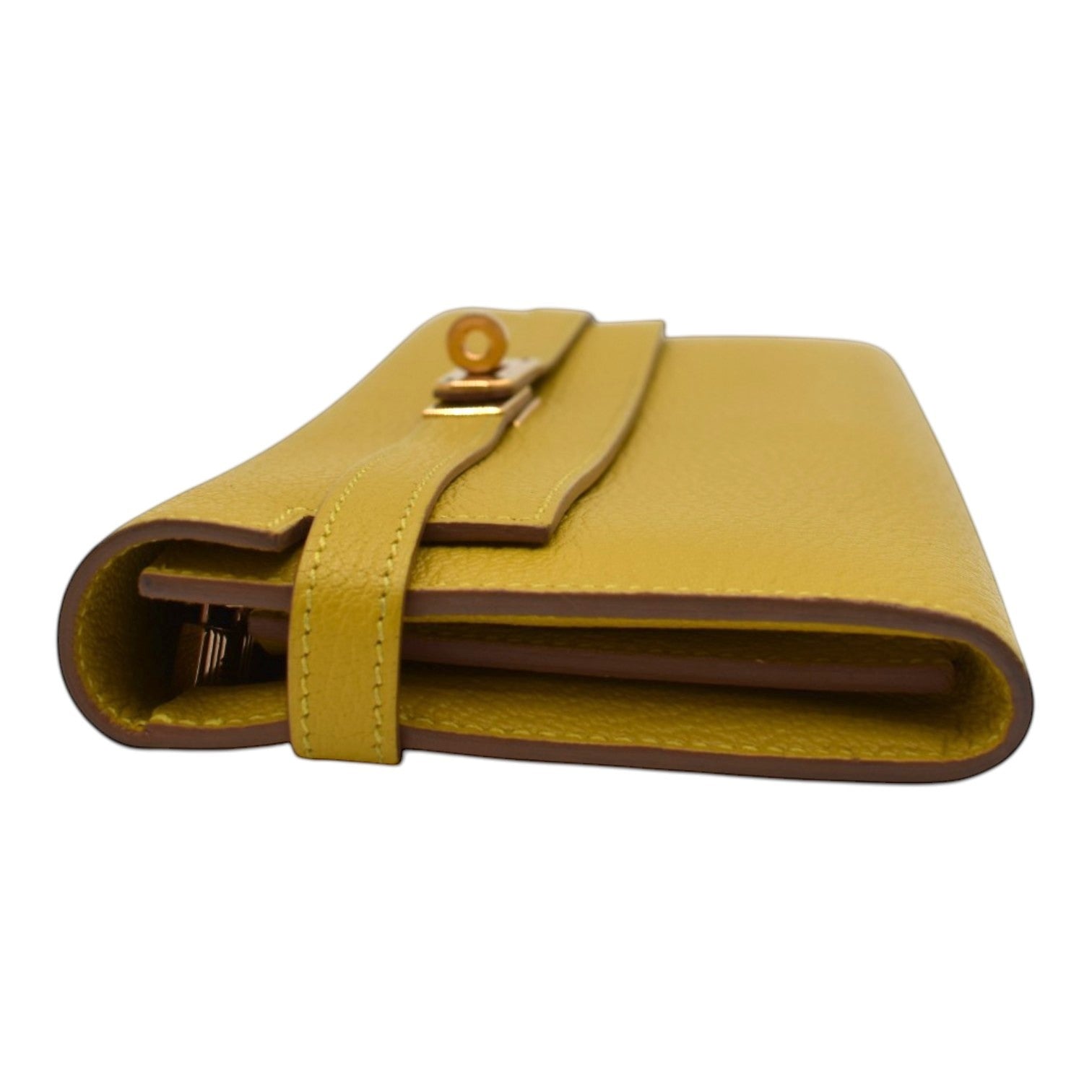 Soldi yellow pebbled leather Kelly Pochette wallet with gold hardware and turn-lock closure.