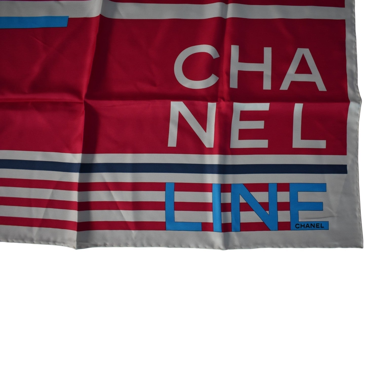 Soldi red and white striped silk scarf with blue 'LINE' logo and Chanel branding.