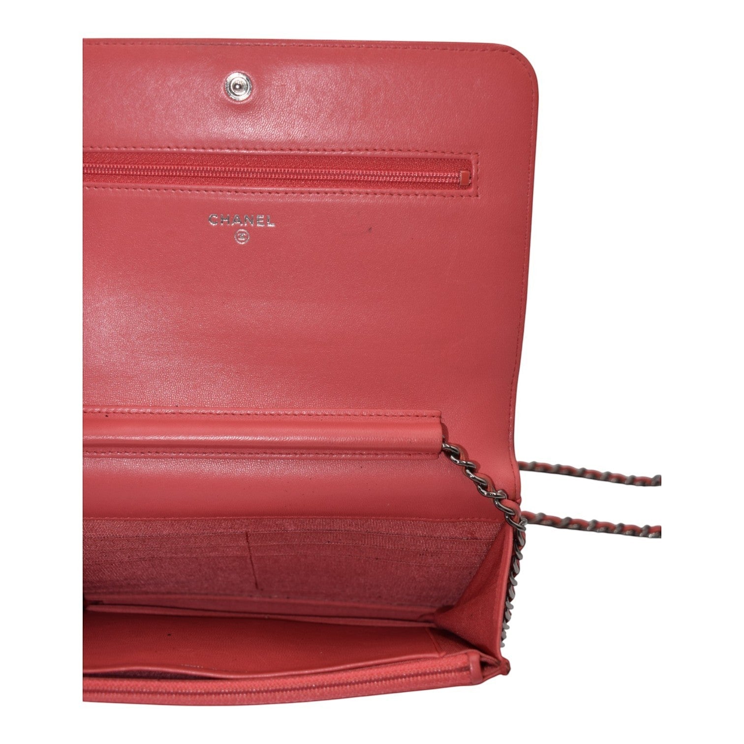 Soldi Chanel pink leather wallet on chain with silver grommets and chain strap, interior card slots and zip pocket.