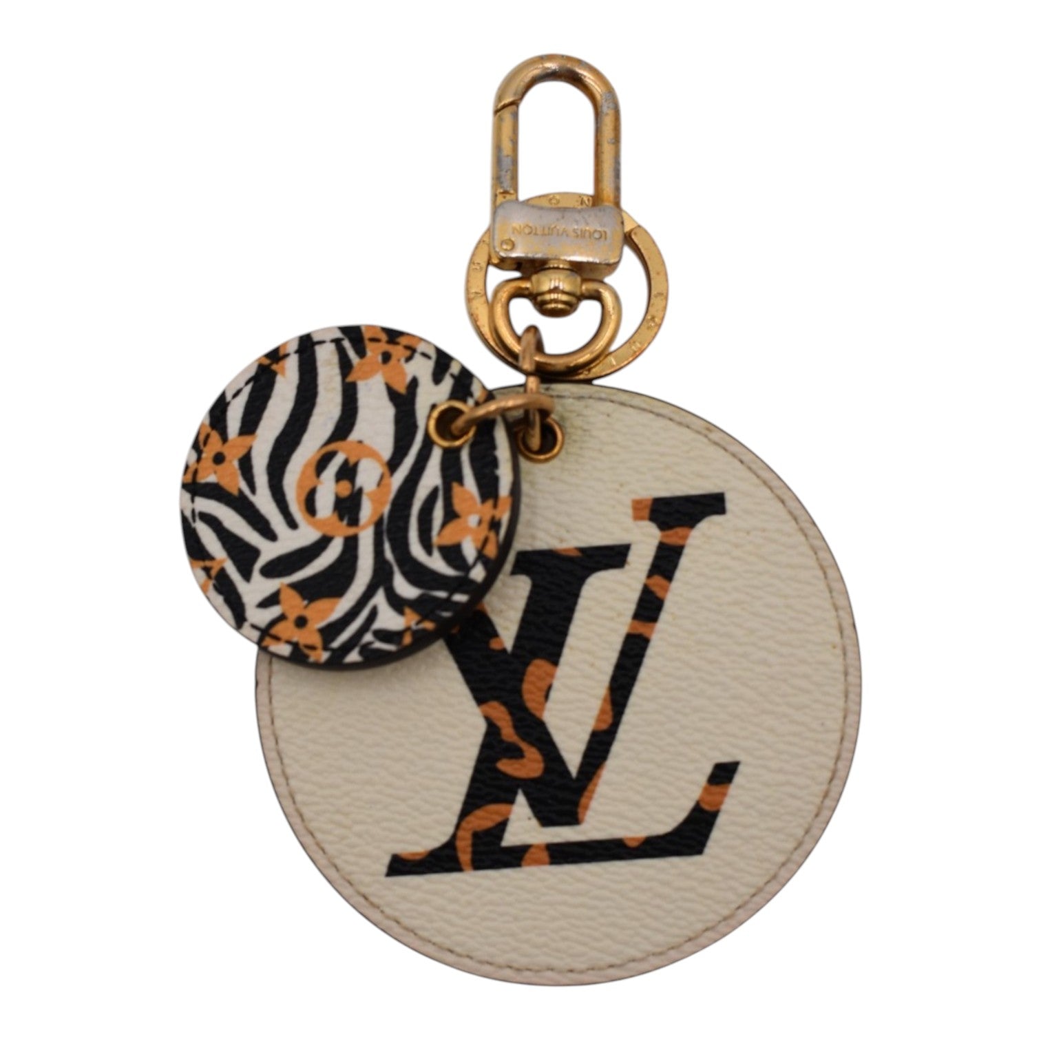 Soldi Jungle Bag Charm with cream, black, and orange animal print and gold hardware.