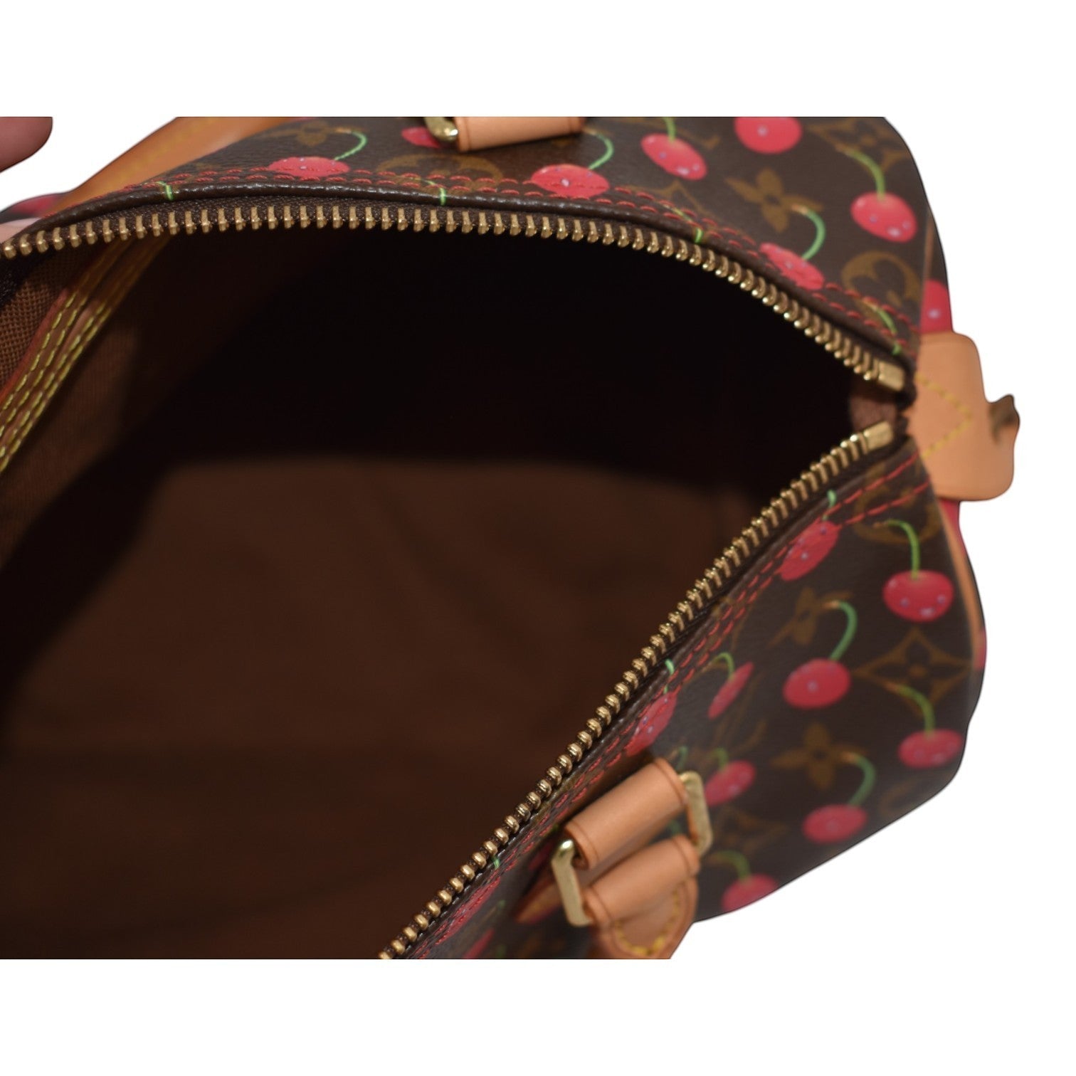 Soldi Louis Vuitton Cherry Speedy monogram canvas handbag with red cherry print and tan leather trim.