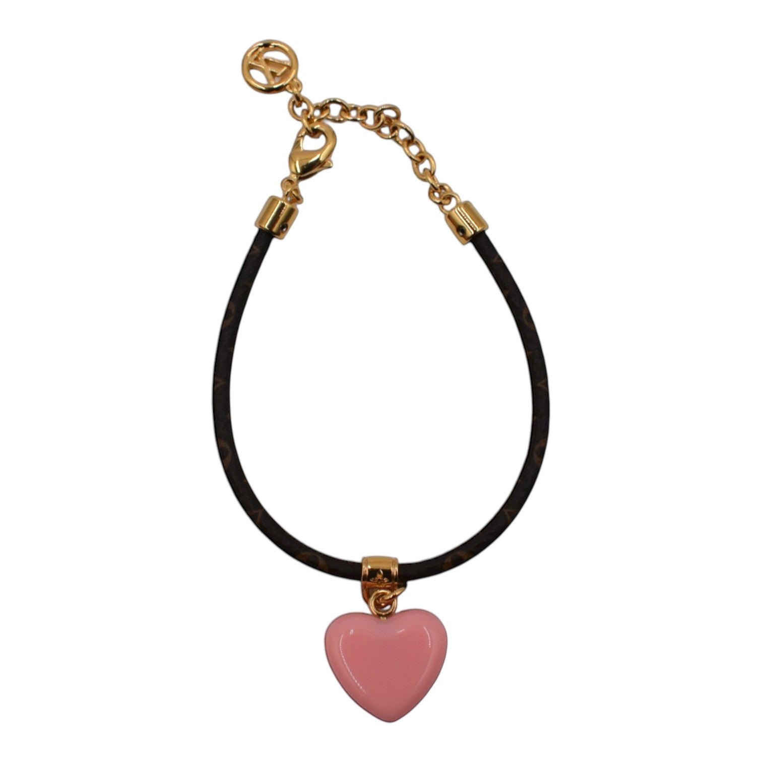 Soldi bracelet with a pink heart charm and gold-tone chain. Features a monogram pattern on the band.