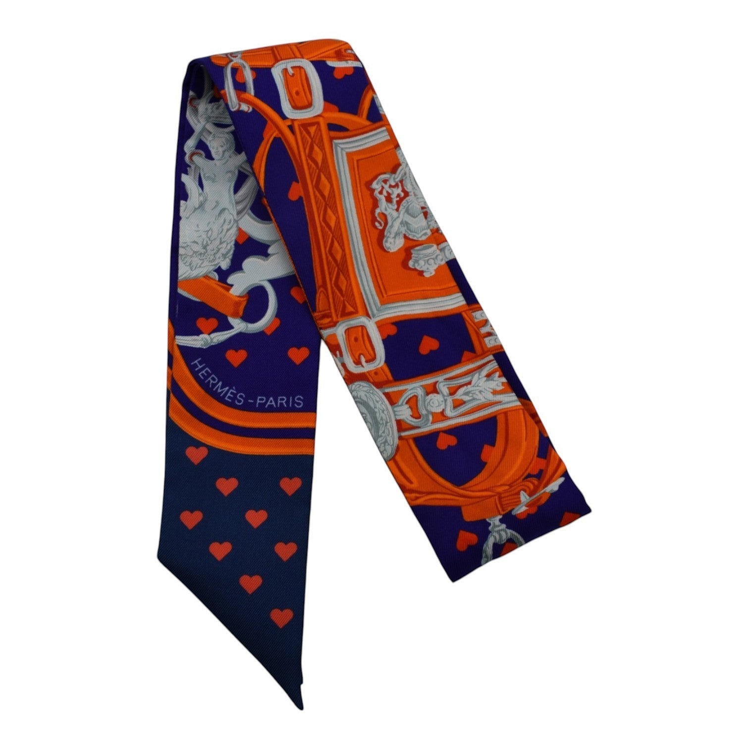 Soldi navy blue silk twilly scarf with orange heart pattern and equestrian motifs.