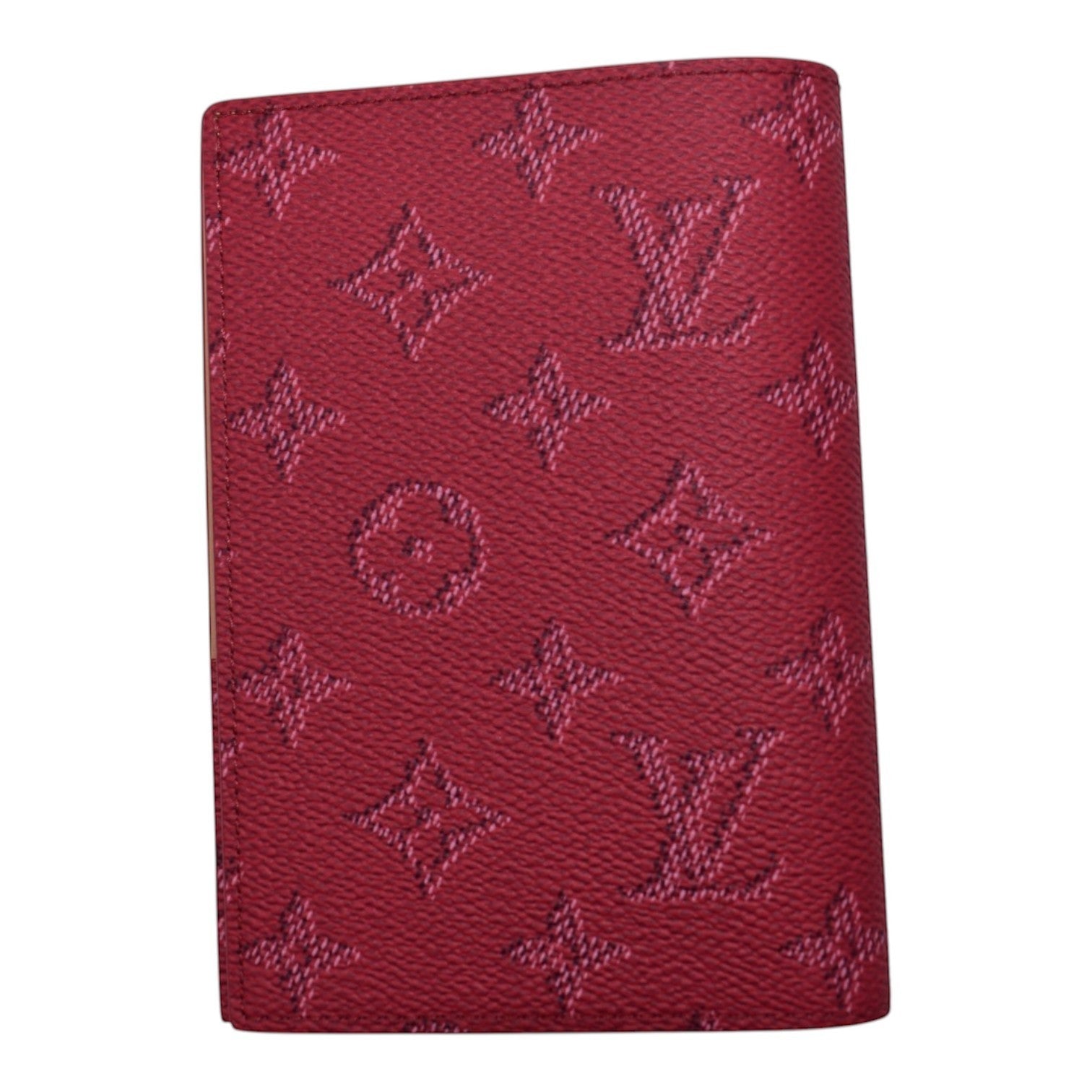 Soldi embossed monogram passport cover in dark pink.