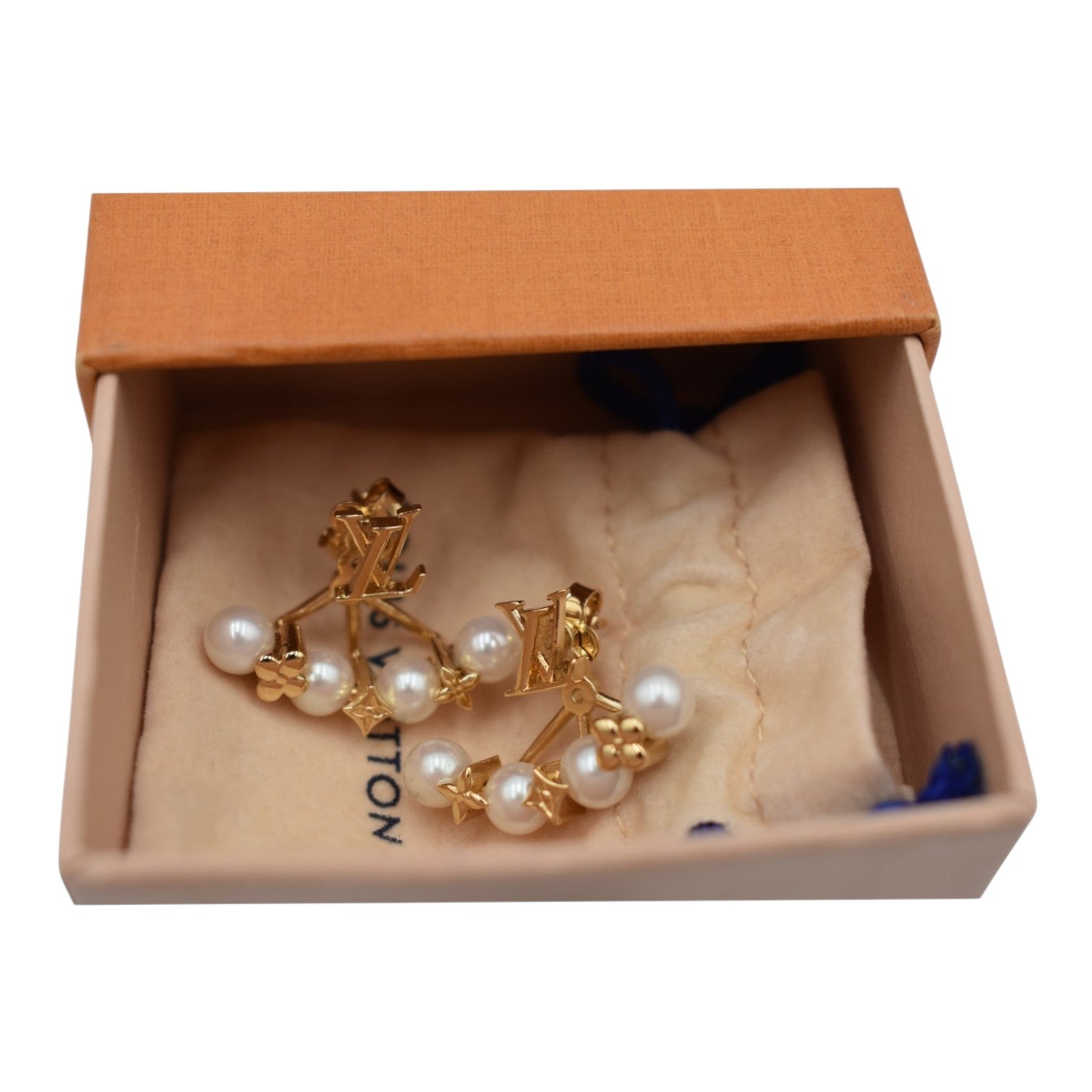 Soldi gold cuff earrings with pearl drops and LV monogram details, presented in a box.