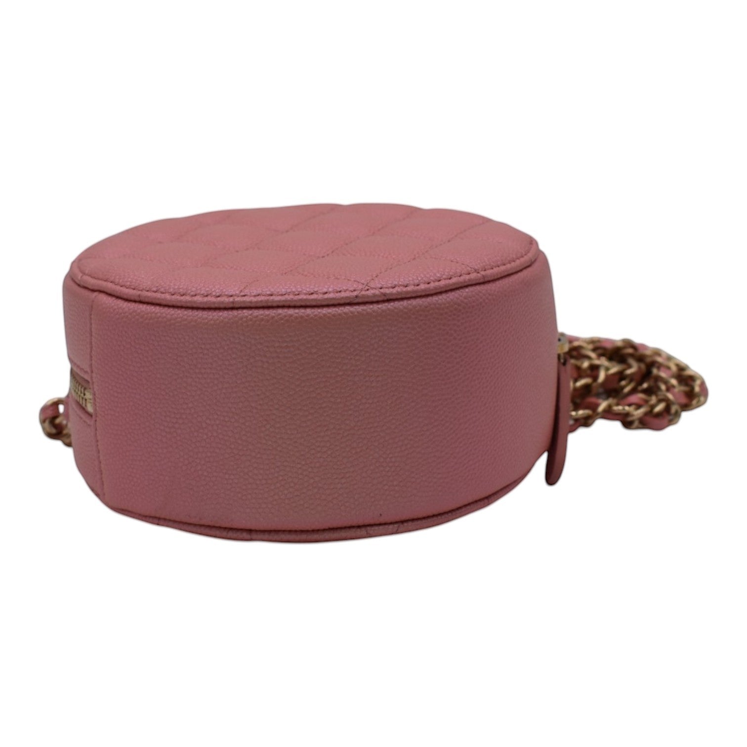 Soldi pink caviar leather quilted circle mini vanity bag with pearl CC detail and gold chain strap.