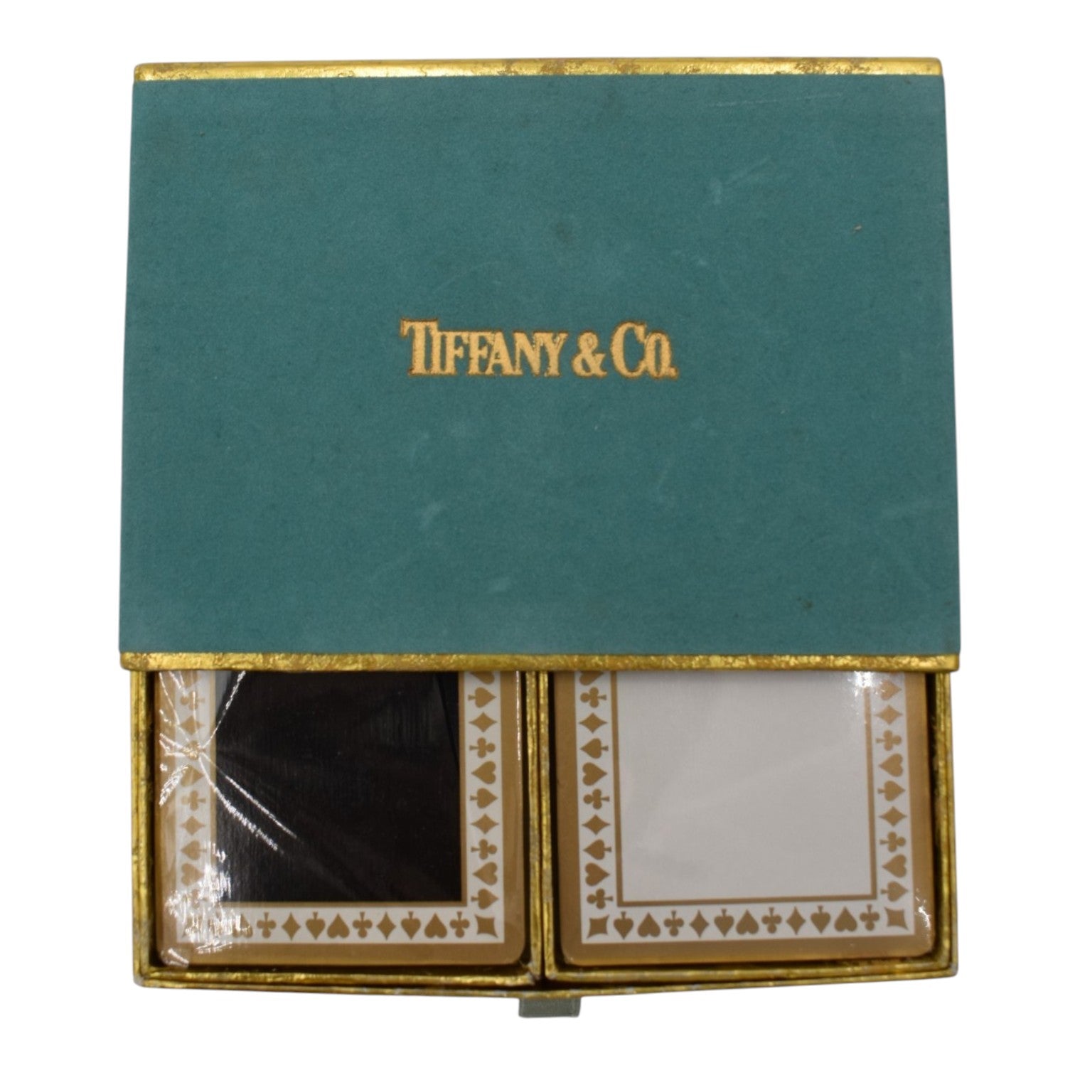 Soldi black and white playing cards in a teal Tiffany & Co. box with gold trim. Features card suit borders.