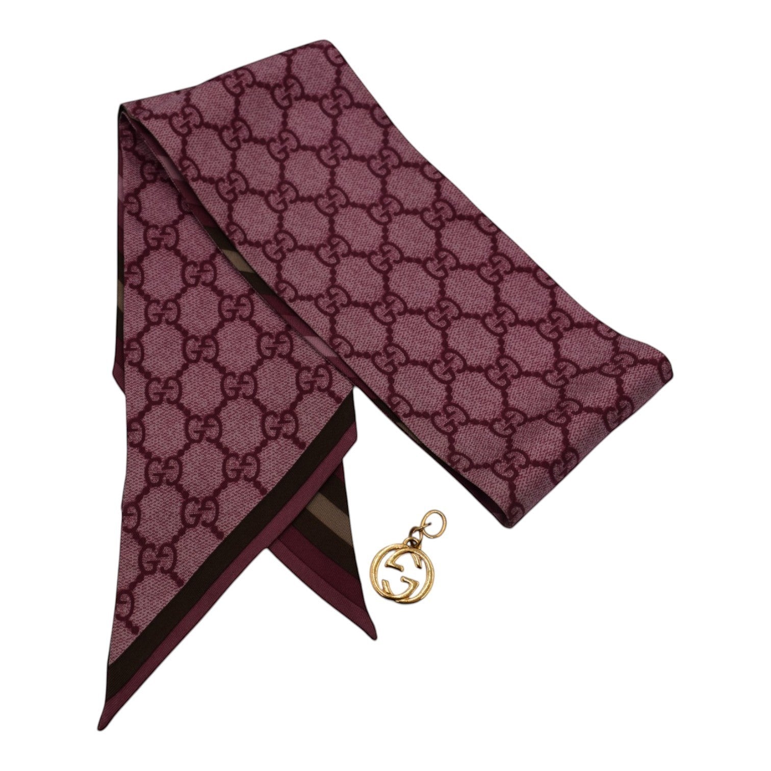 Soldi purple twilly scarf with all-over GG monogram pattern and gold GG charm.
