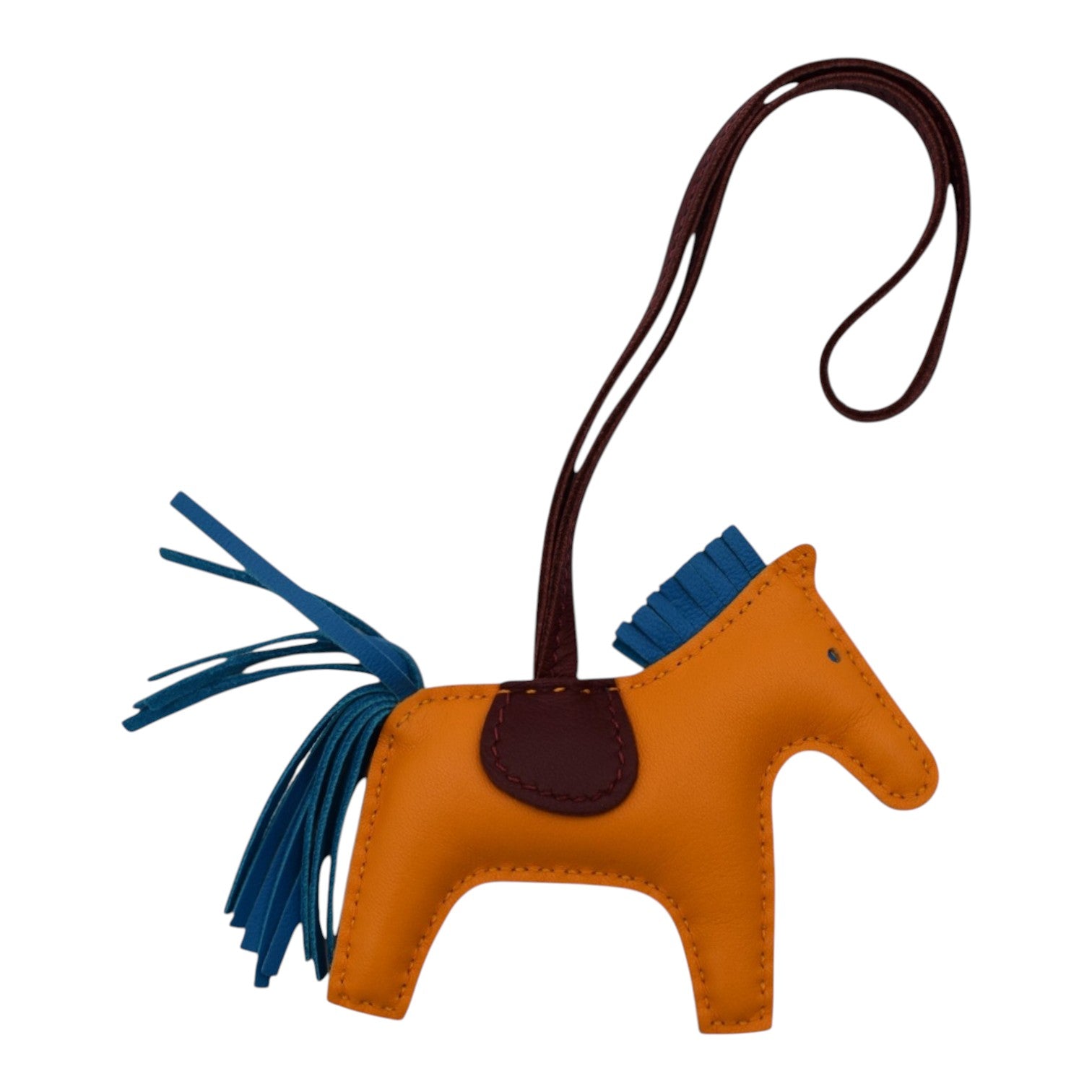 Soldi Rodeo Charm in orange leather with blue accents and a dark brown leather strap.