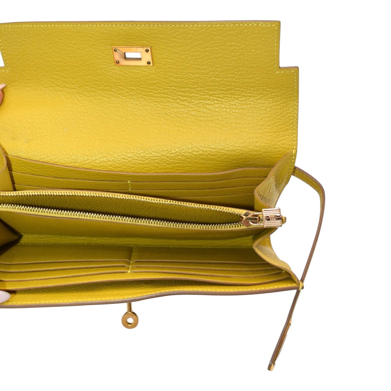 Soldi yellow pebbled leather Kelly pochette wallet with gold hardware and multiple card slots.